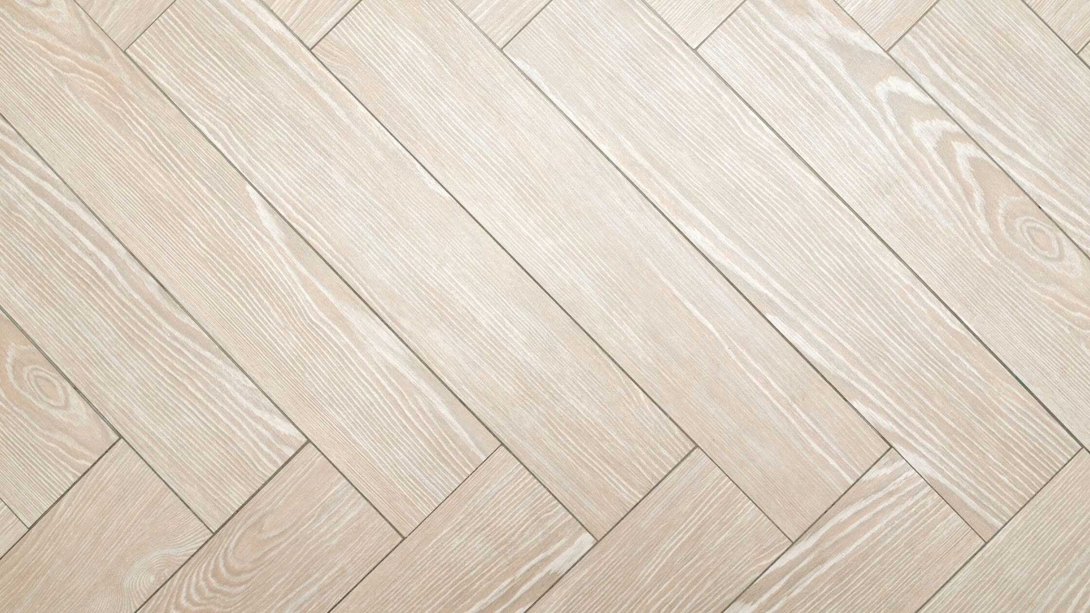 Light wood flooring with herringbone pattern, ideal for modern home interiors.
