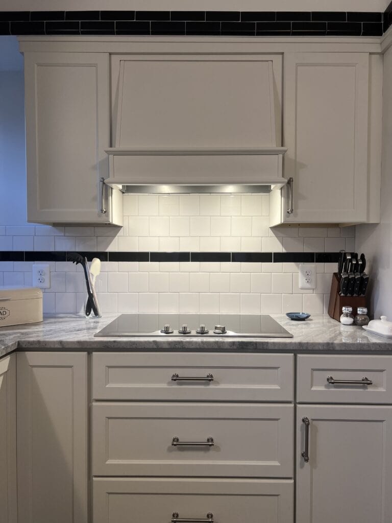 Elegant white kitchen cabinets with modern design and sleek hardware.