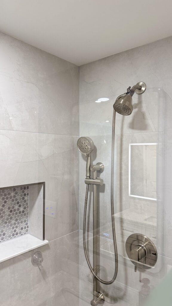 Stylish modern shower with dual showerheads and sleek fixtures.