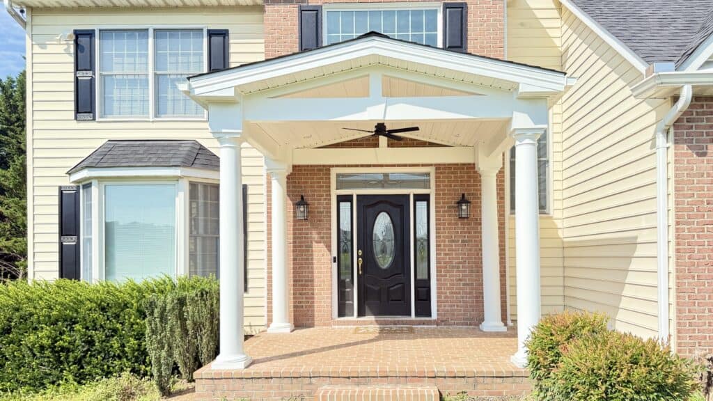 Beautiful house exterior with updated front porch and landscaping.