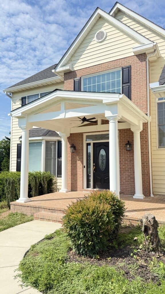 Beautiful house with a new porch and modern design. Perfect for enhancing curb appeal and home value.
