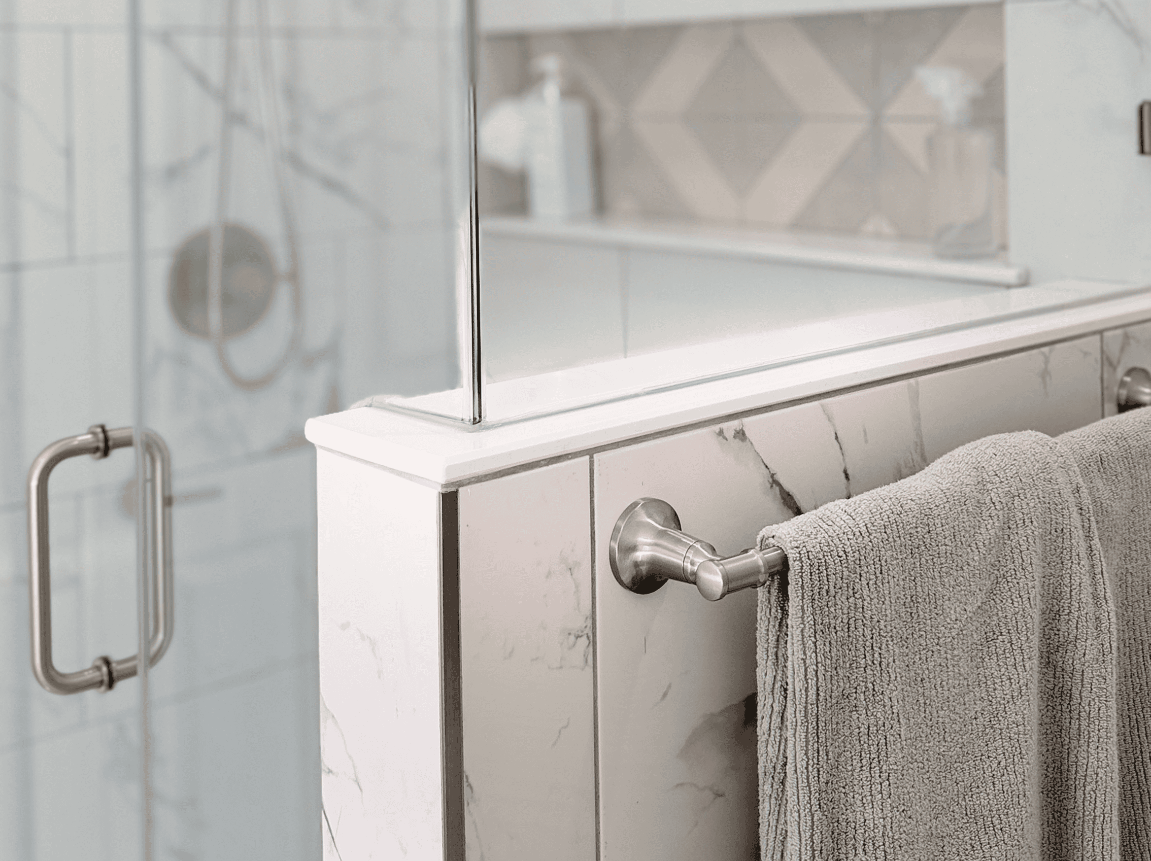 Modern bathroom with glass shower enclosure and stylish tile accents.