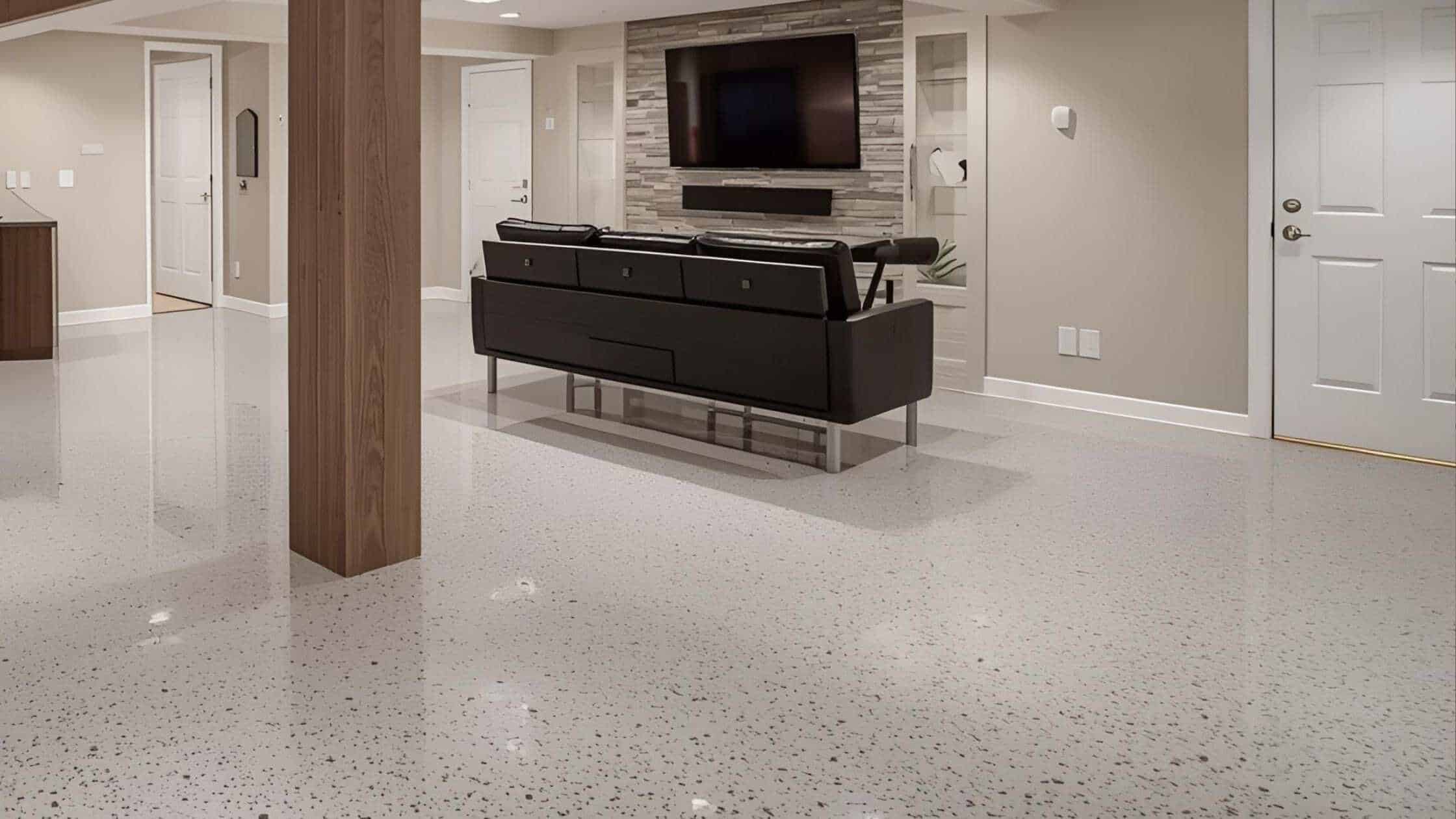 Stylish living room with a large TV, black sofa, and modern decor in a home renovation.